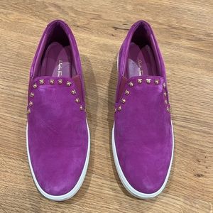 Salvatore Ferragamo Suede Slip-On Sneakers
Round-Toes with Studded Accents